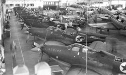P-39s getting red star painted in a Blatchford Hangar WW2.jpg